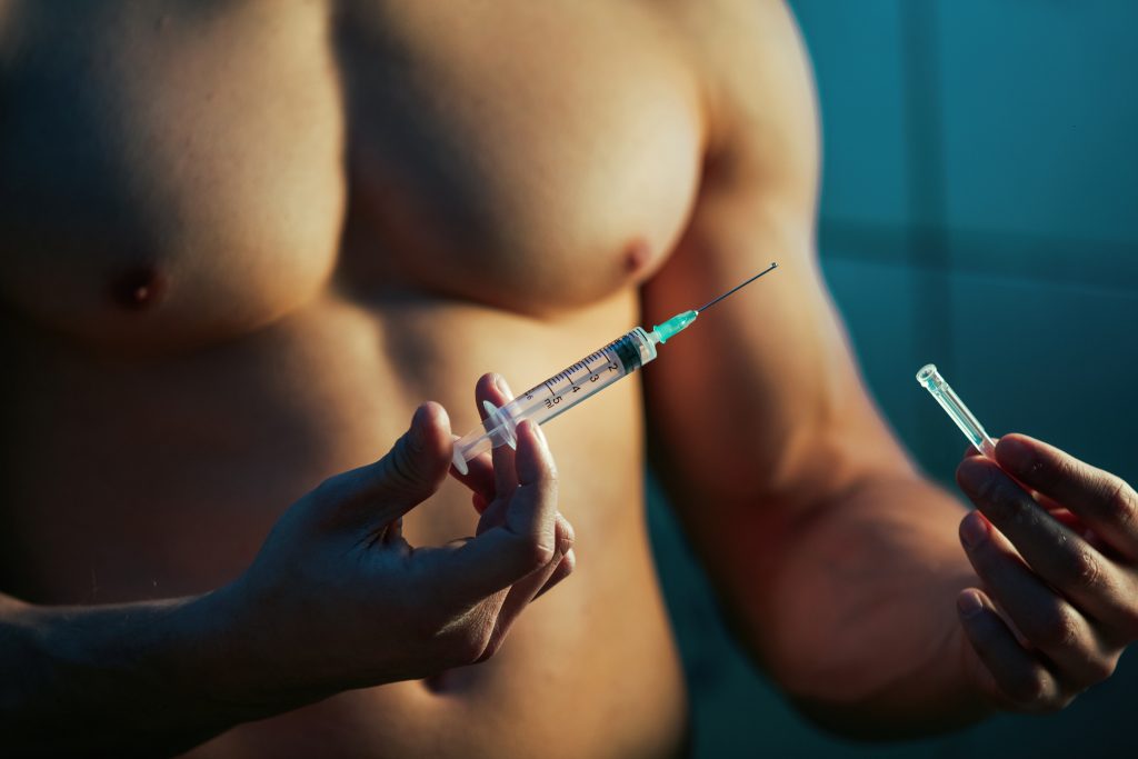 Photo of person and injection to find out if 5 ml or 1 ml of Testosterone a Week Enough