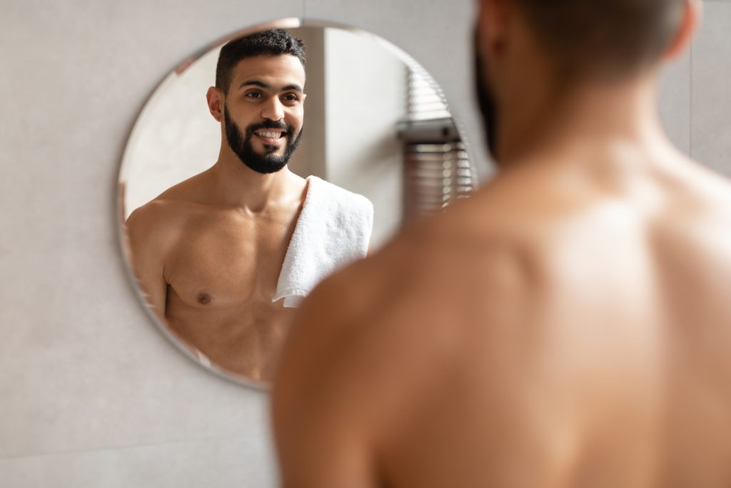 confident young arab guy looking in the mirror 2025 03 18 17 26 54 utc